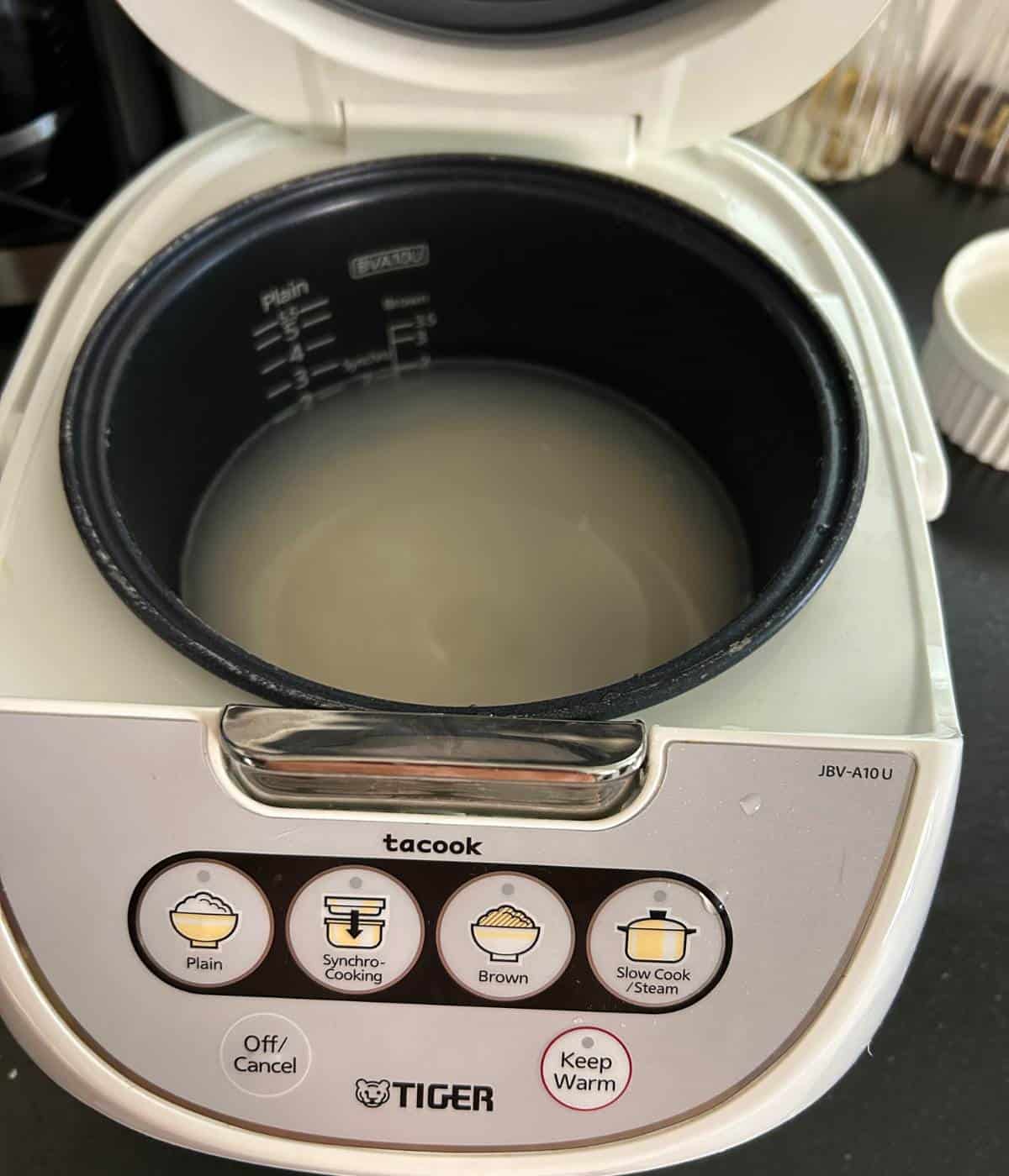 Rice and water in rice cooker.
