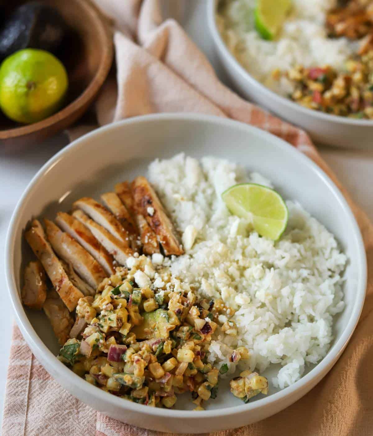 Chicken bowls with rice and street corn salad.