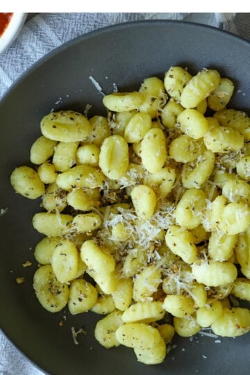 Air Fryer Gnocchi in bowl with side of marinara.