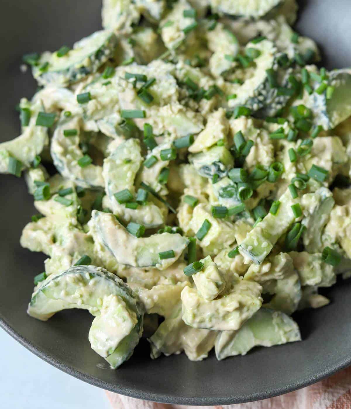 Creamy, spicy avocado salad in bowl.