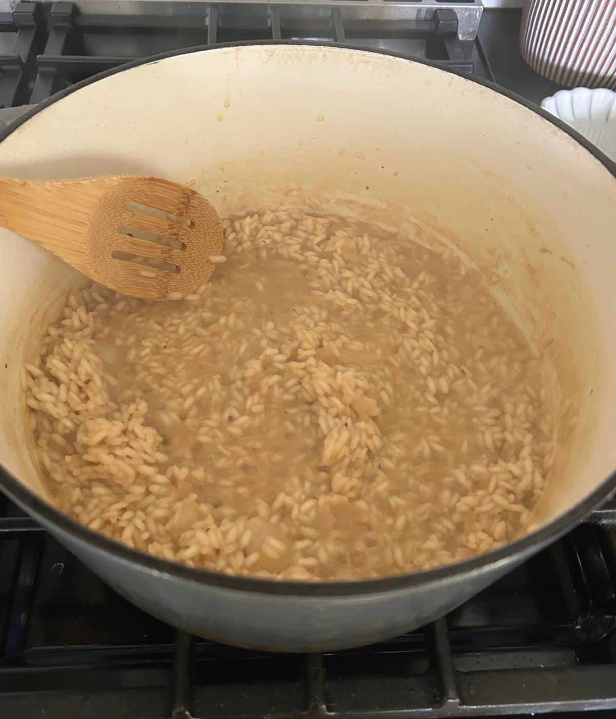 Adding stock for risotto.