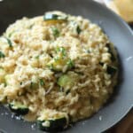 Creamy Risotto with zucchini in bowl.