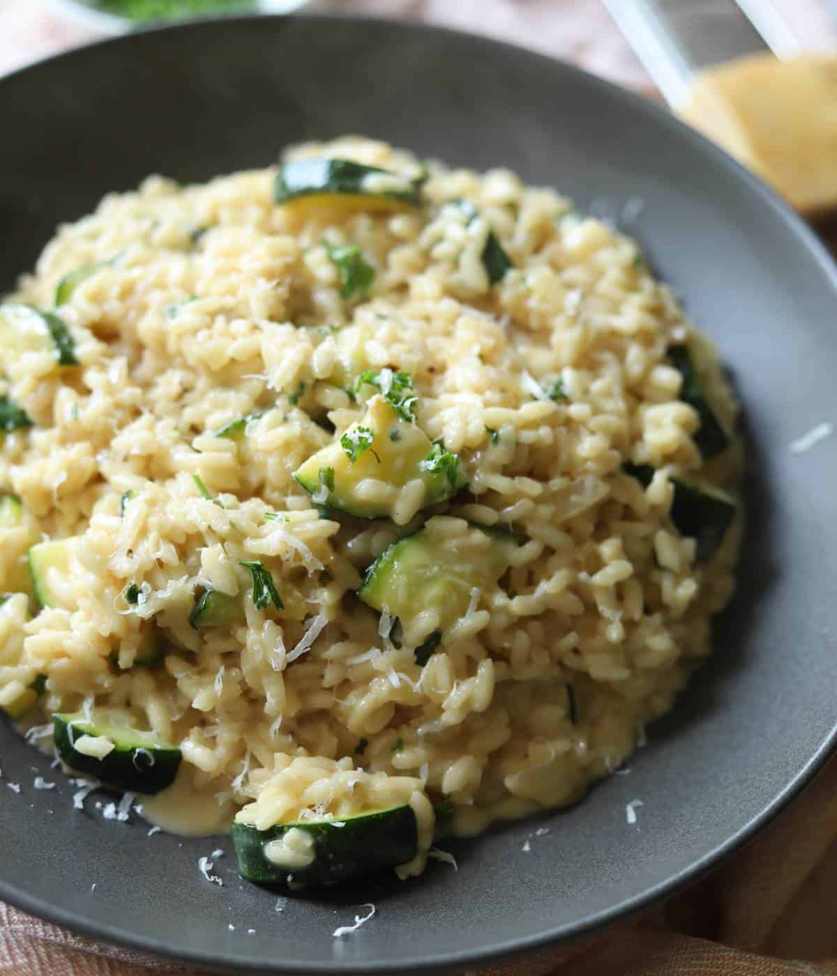 Creamy Risotto with zucchini in bowl. 