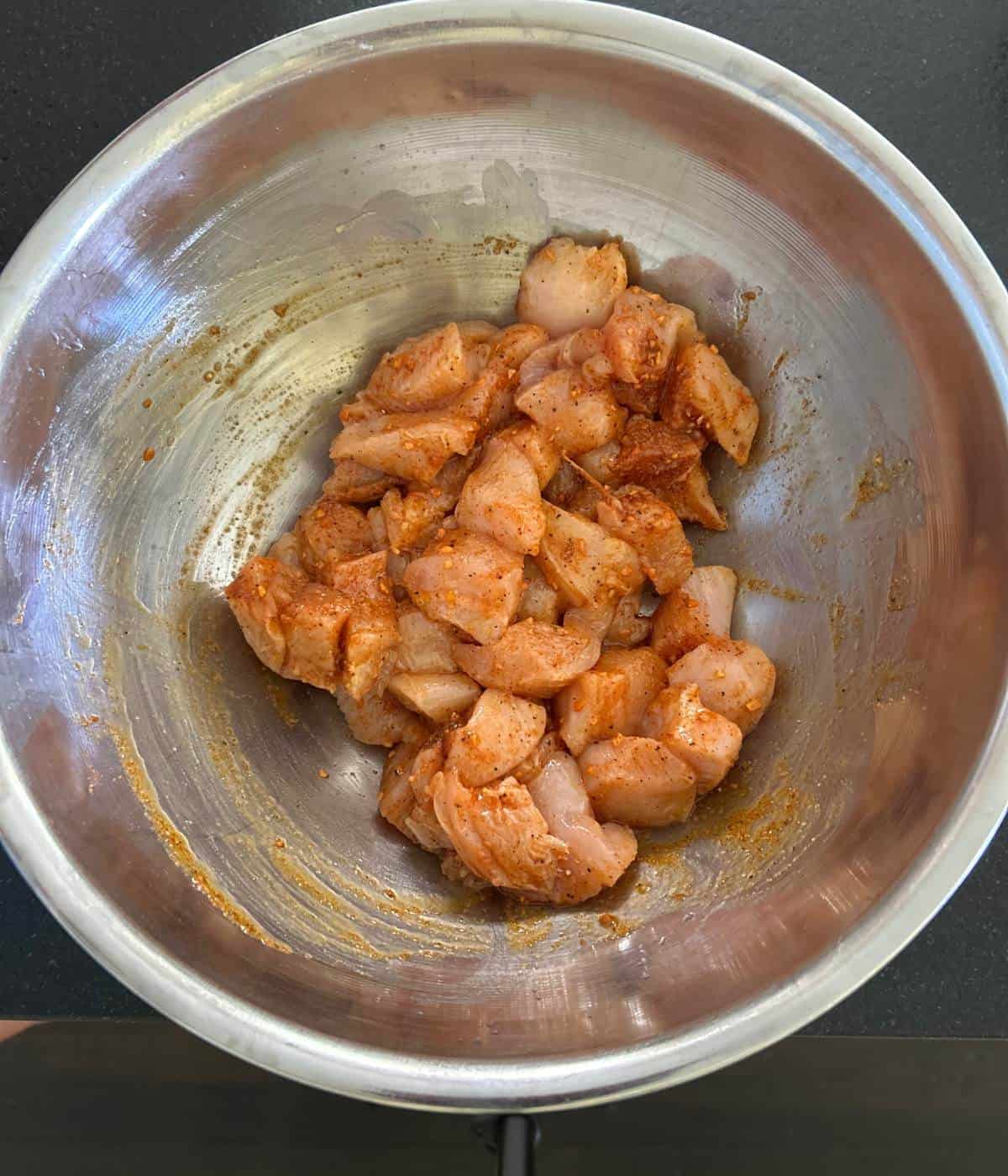 Marinated chicken in bowl.