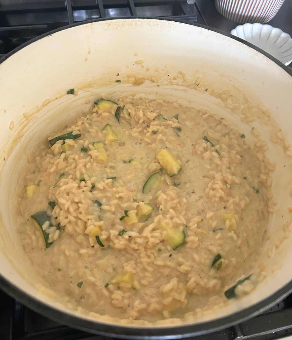 Creamy zucchini risotto in dutch oven.