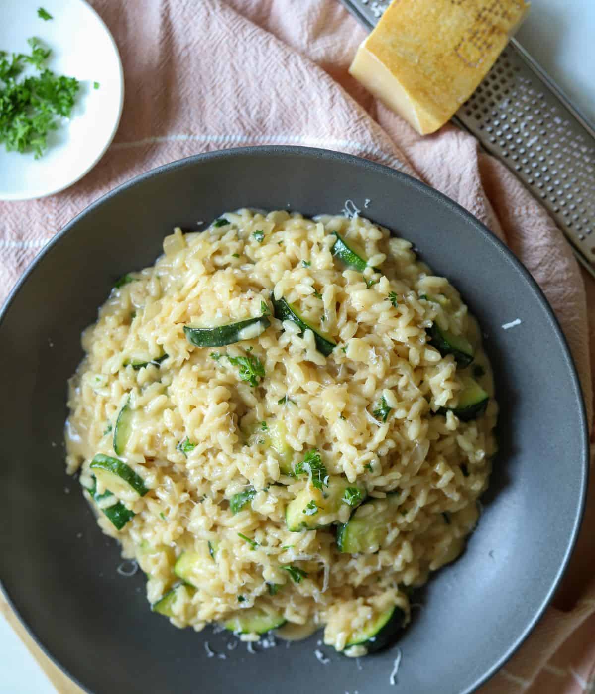 Zucchini risotto in serving dish.
