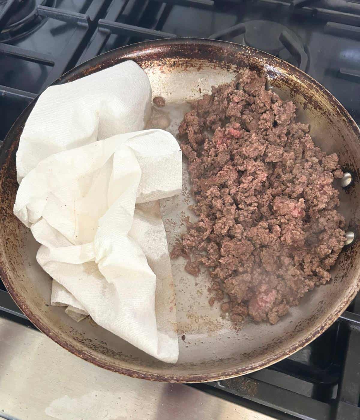 Draining grease in skillet.