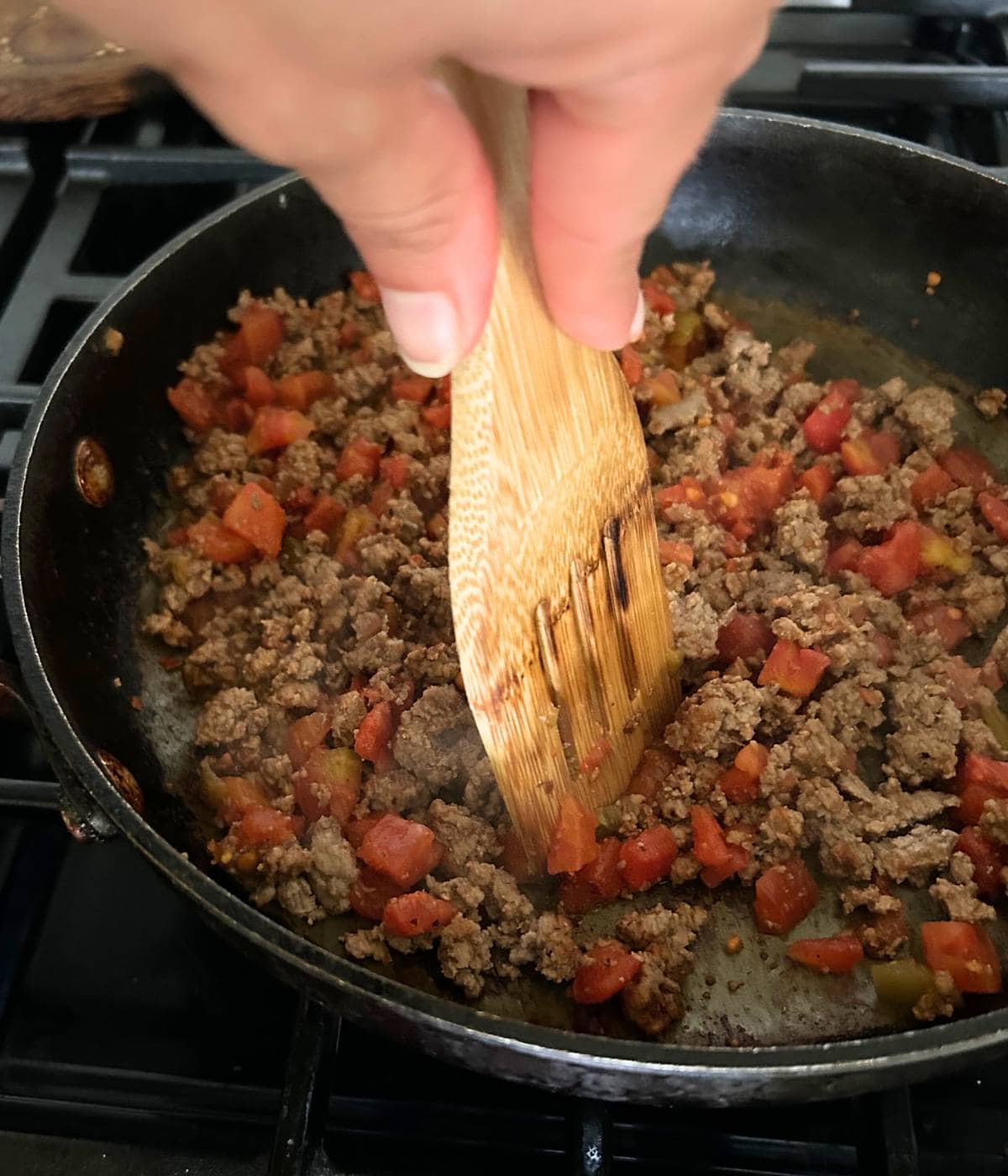 Cooking ground beef and Rotel.