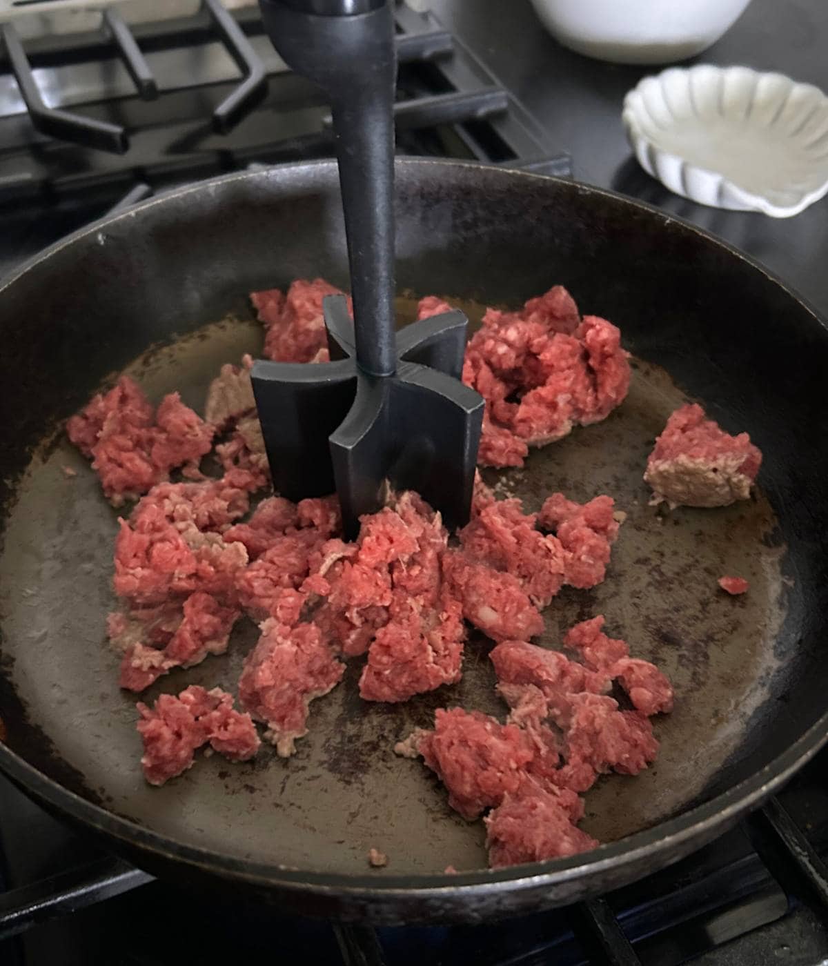 Ground beef in skillet.