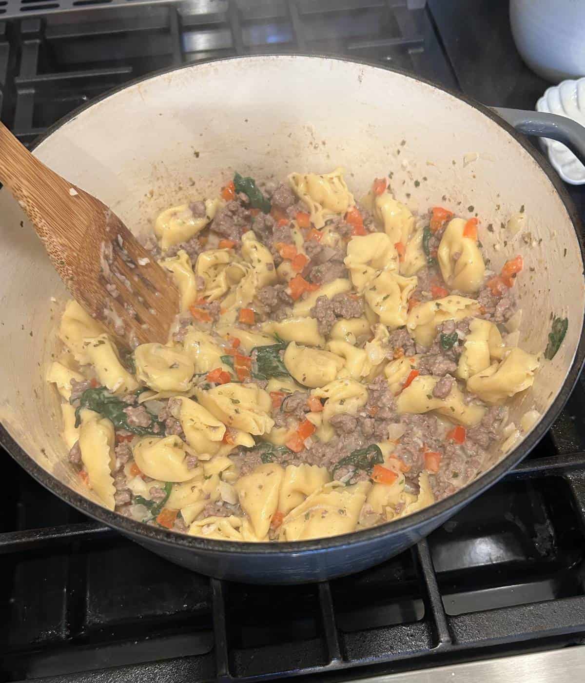 Cheese added to pot.