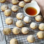 Pancake bites on baking rack topped with powdered sugar.