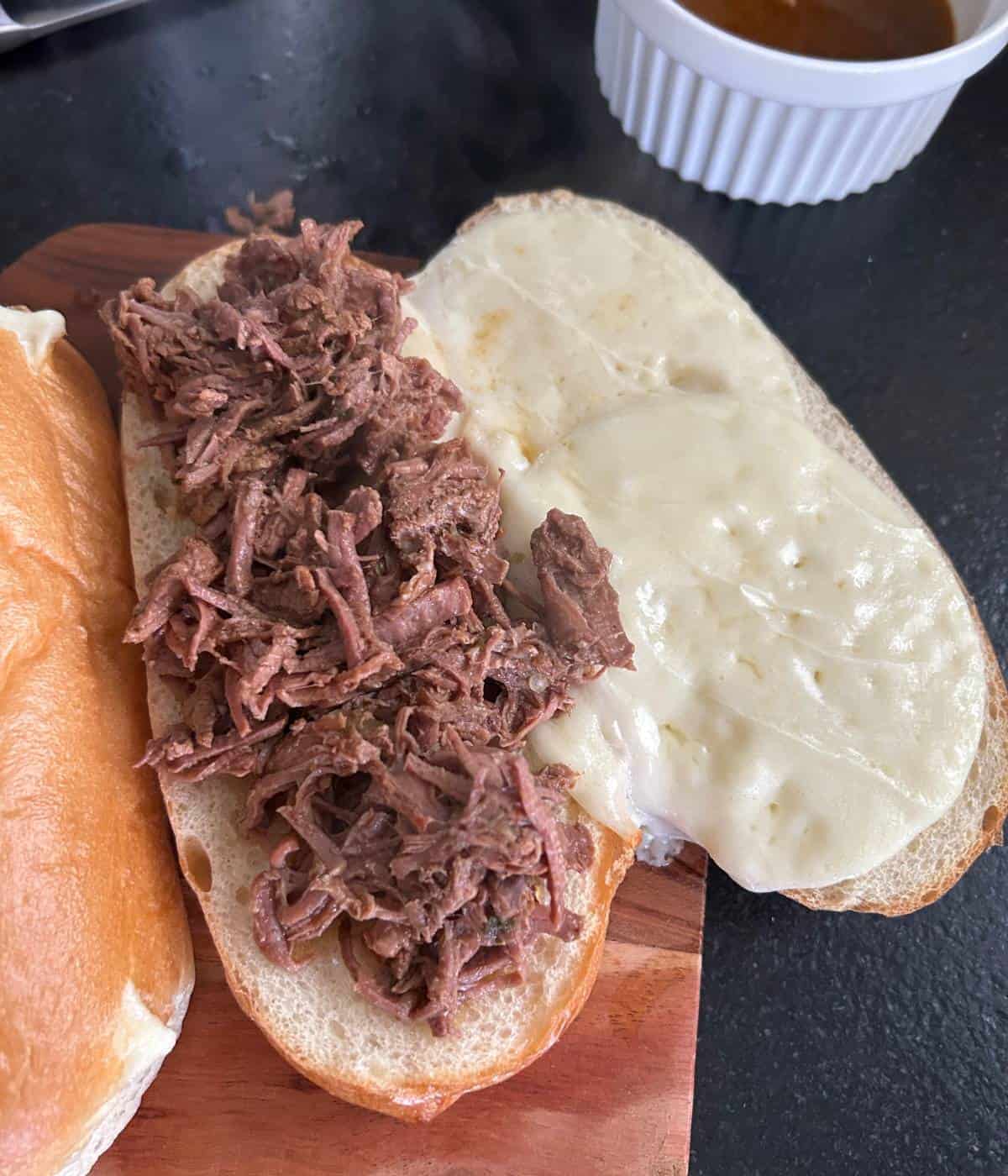 Pulled beef on sandwich.