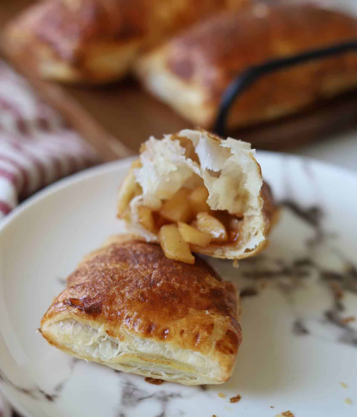 Apple filling inside puff pastry.