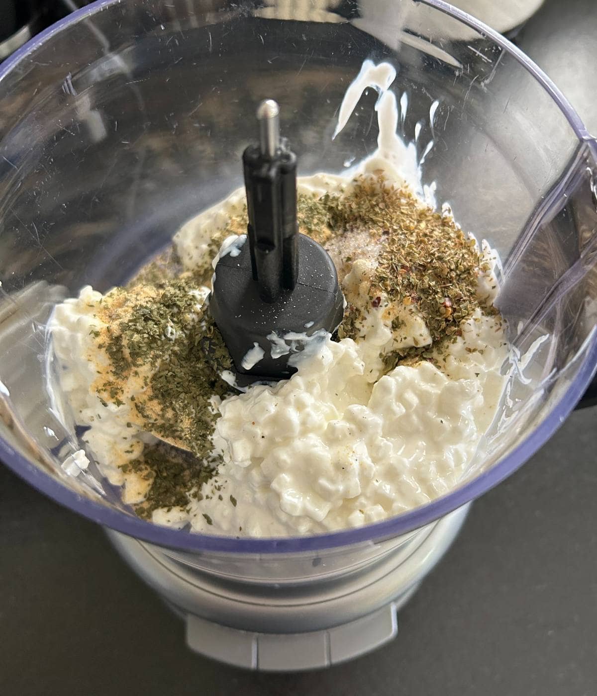 Cottage cheese and spices in food processor.