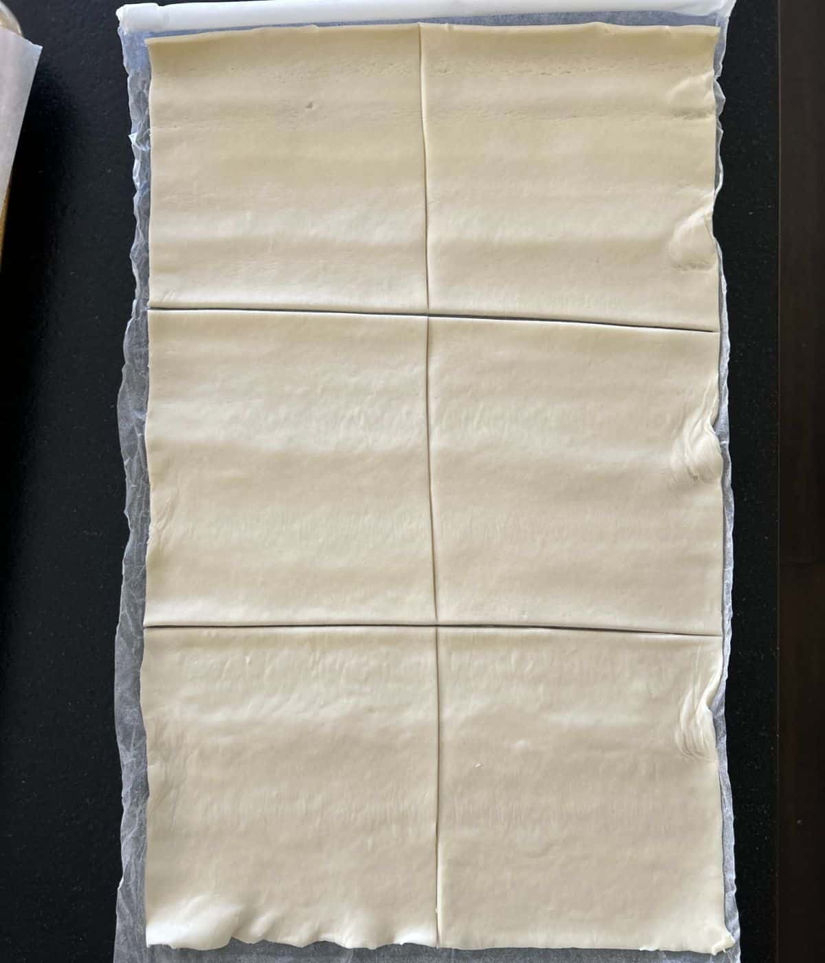 Puff pastry sliced into squares.
