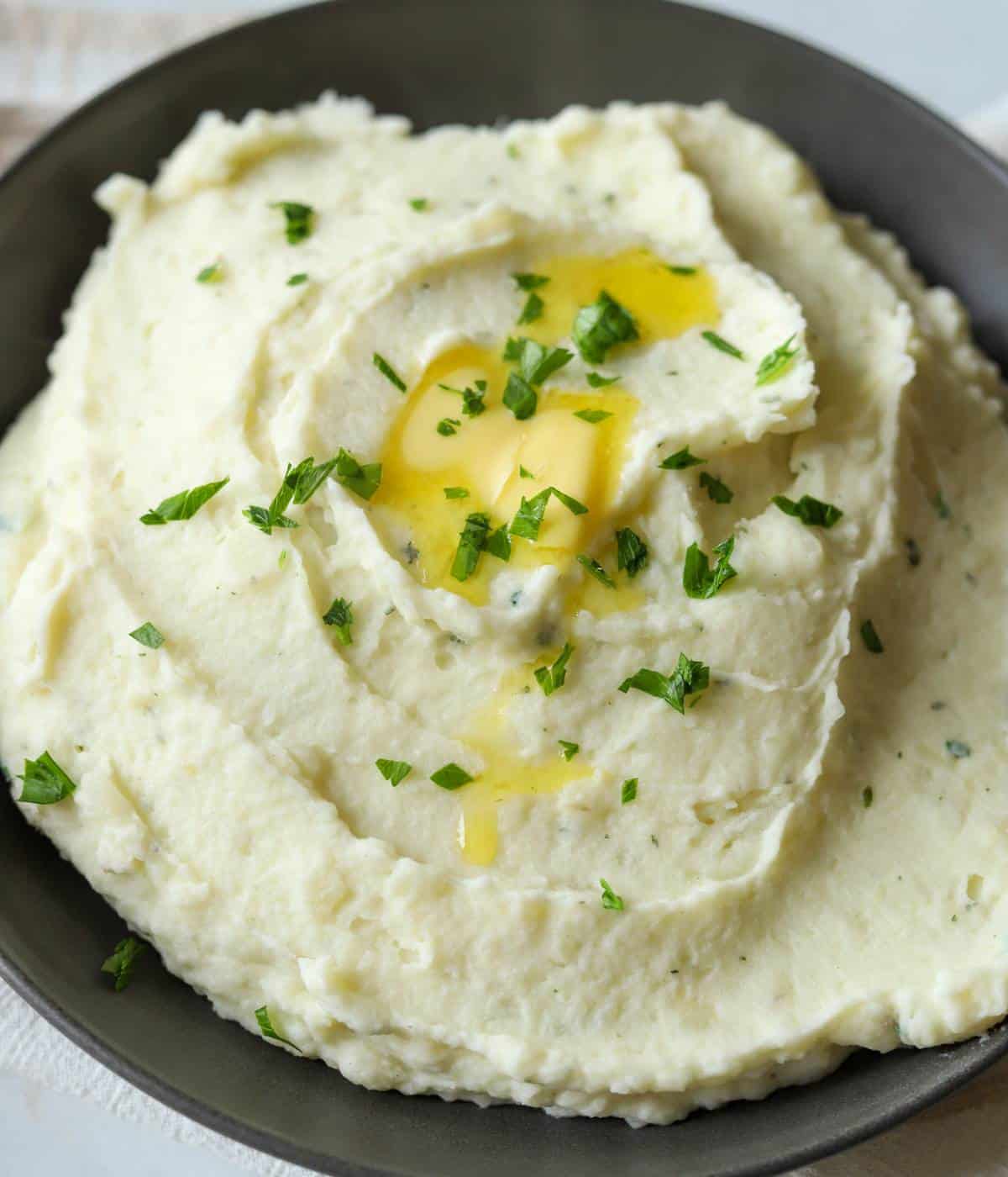 Boursin cheese mashed potatoes in dish.