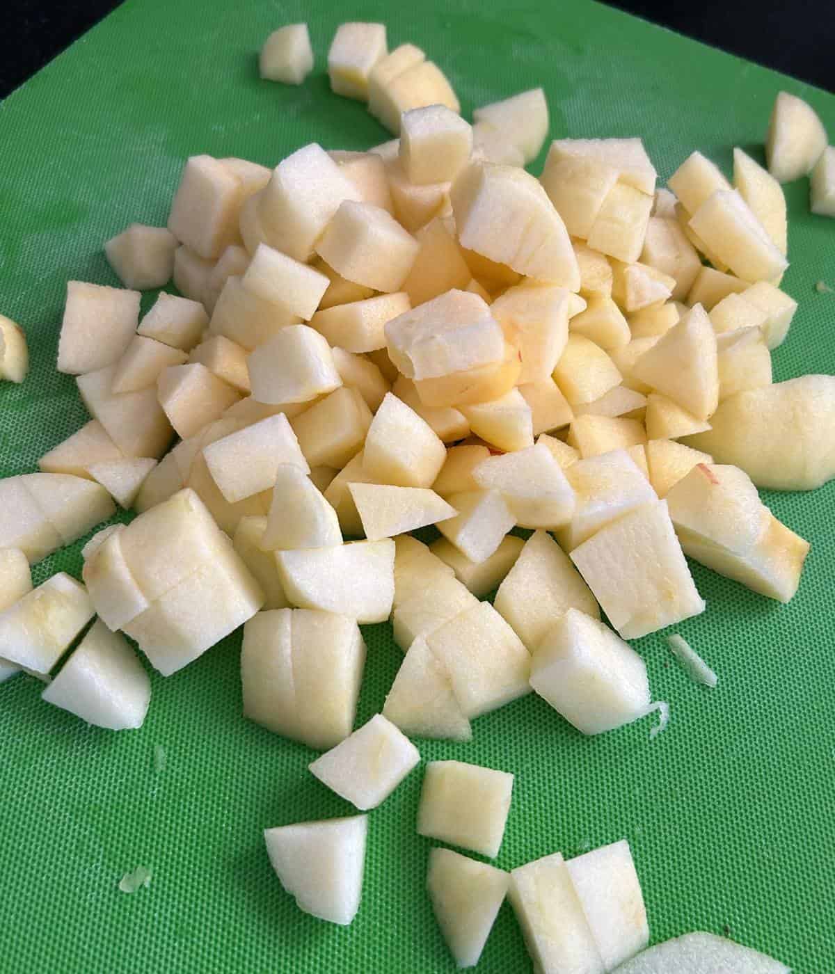 Diced apples on cutting board.