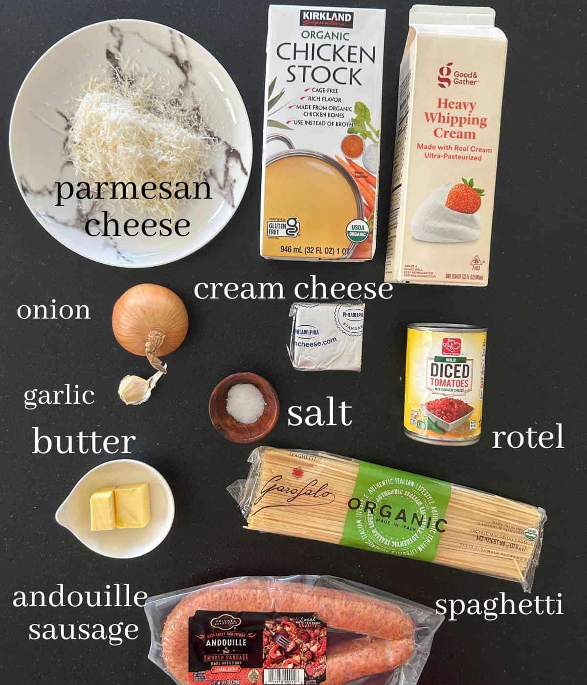 Ingredients for cajun pasta on countertop.