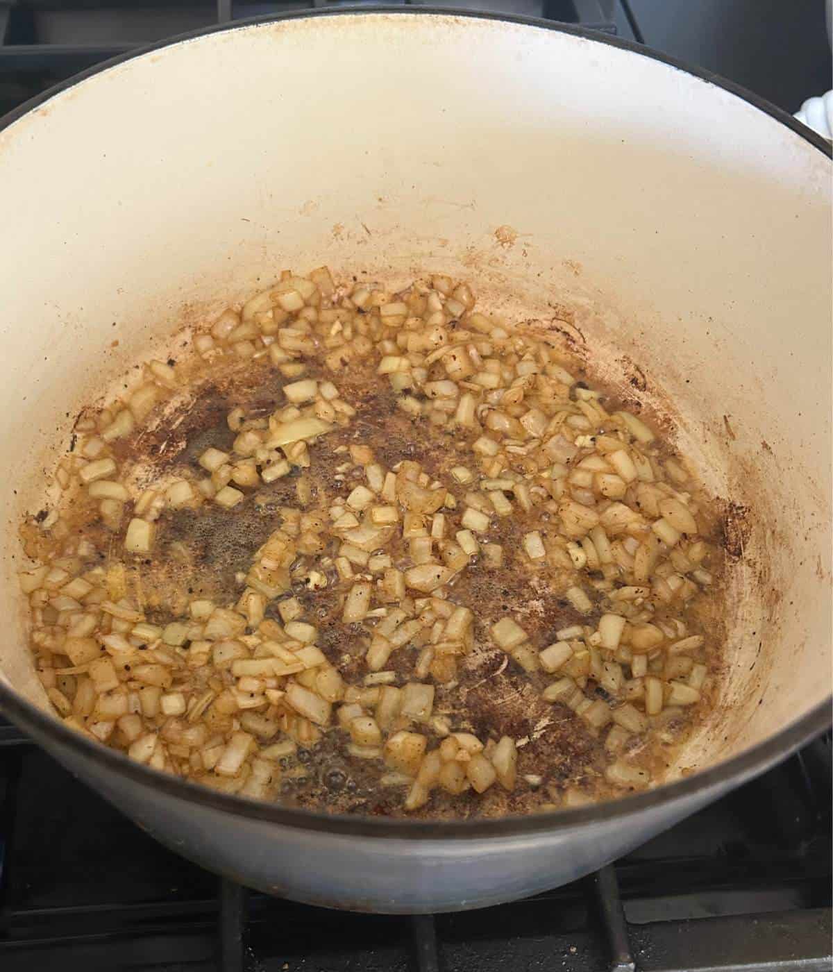 Onions cooking in pot.