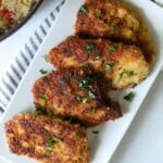 Pan seared pork cutlets on platter.