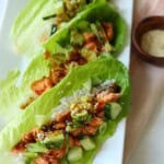 Salmon lettuce wraps on plate.