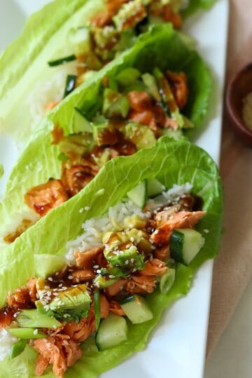Salmon lettuce wraps on plate.