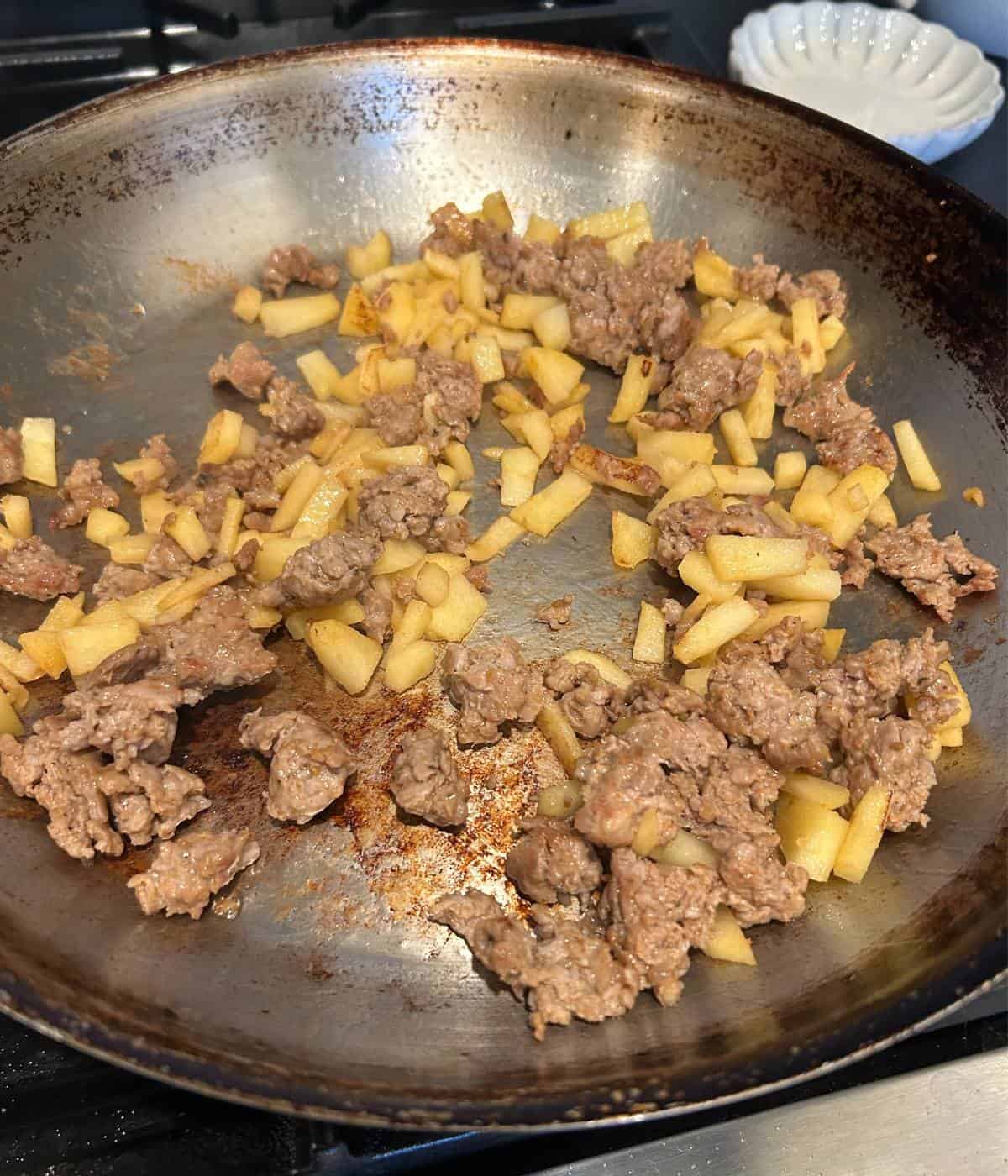 Sausage apple filling in skillet.