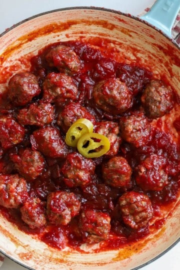 Cranberry meatballs in skillet.