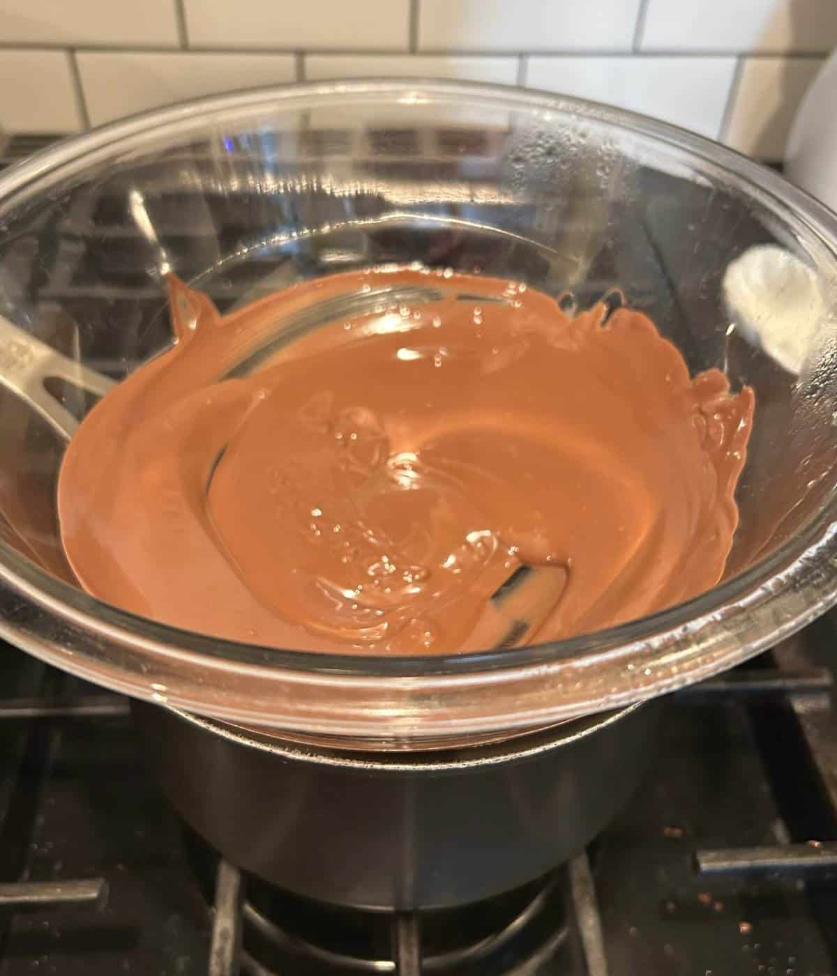 Milk chocolate in double boiler.