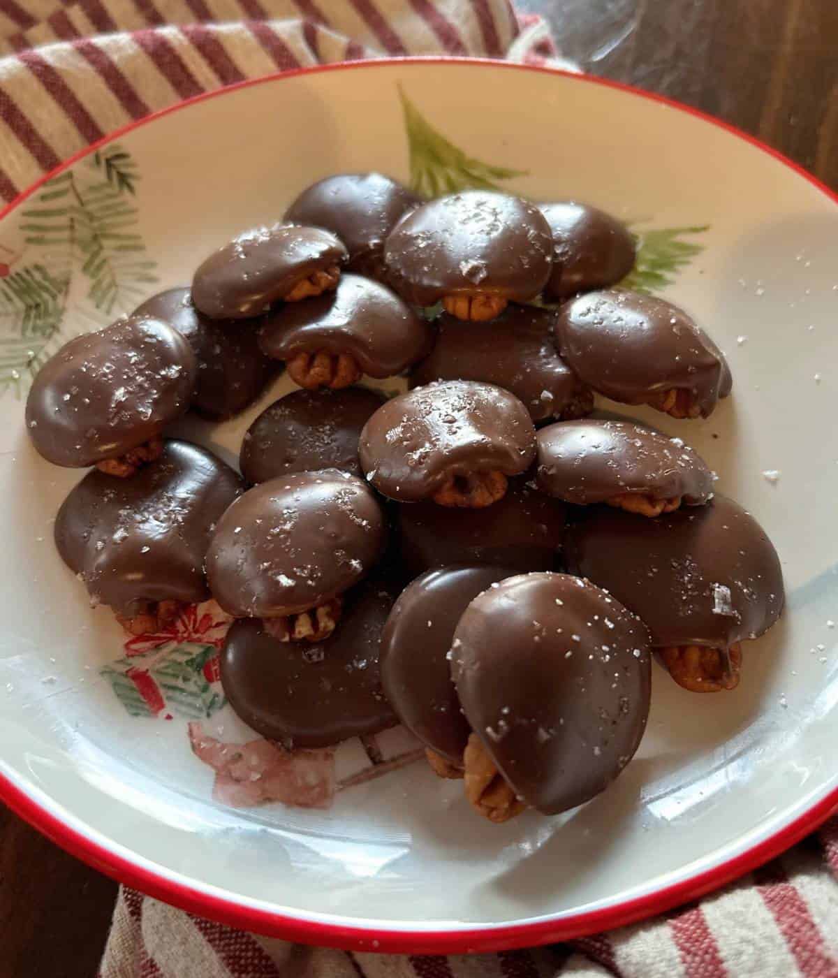 Chocolate Pecan Turtles on plate. 