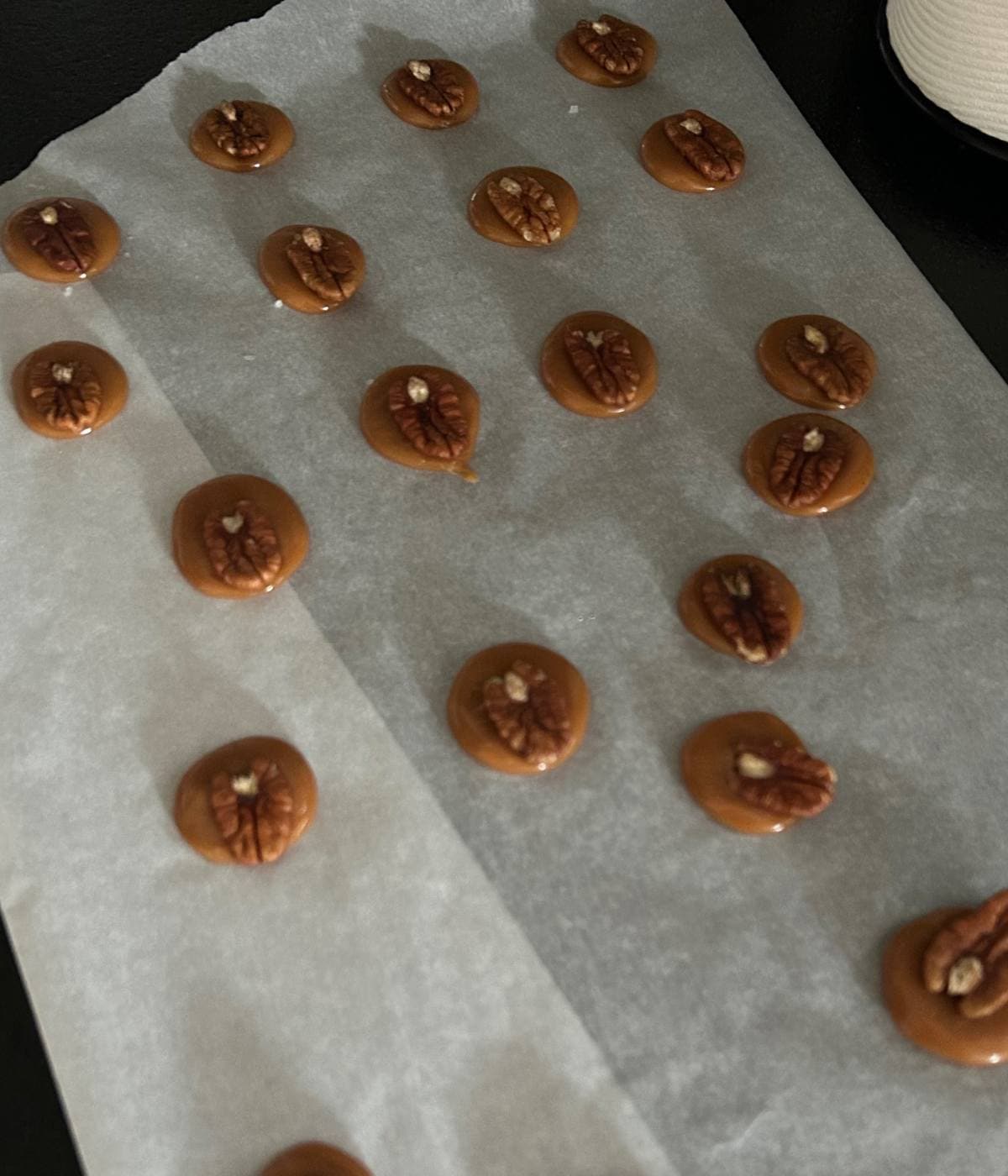 Pecans on top of caramel.