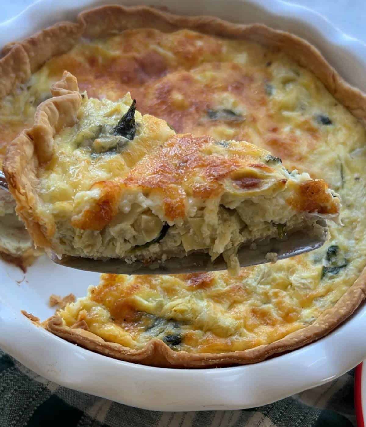 Spinach artichoke quiche slice.