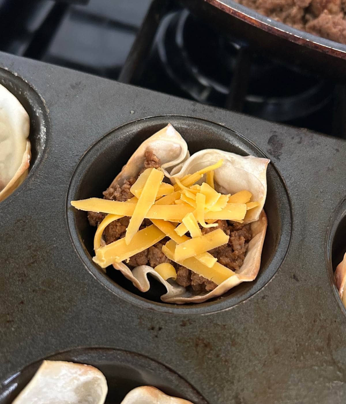 Beef and cheese topped wonton wrappers.