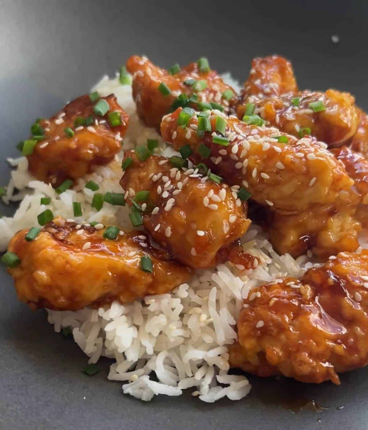 Crispy orange chicken over rice. 