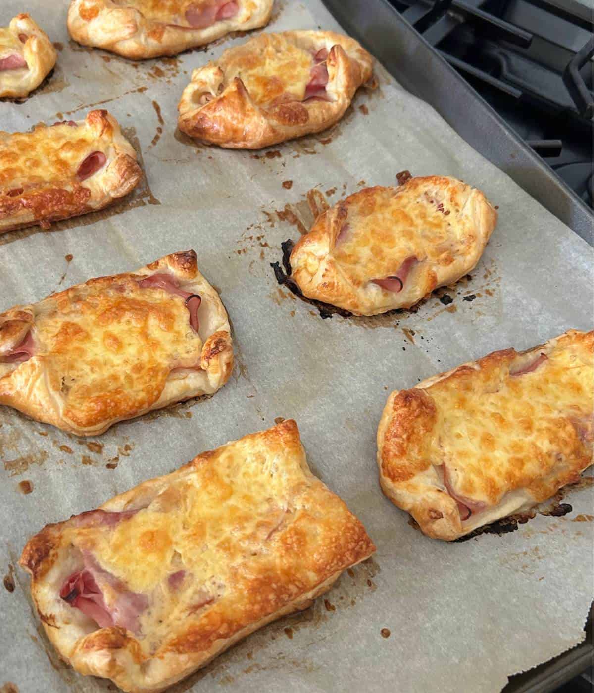 Baked puff pastry with ham and cheese.