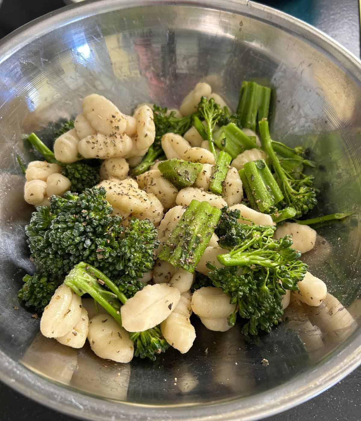 Gnocchi and broccolini in bowl.