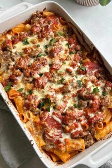 Rigatoni and sausage in casserole dish.