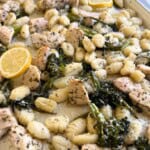 Gnocchi, broccolini and chicken on cookie sheet.