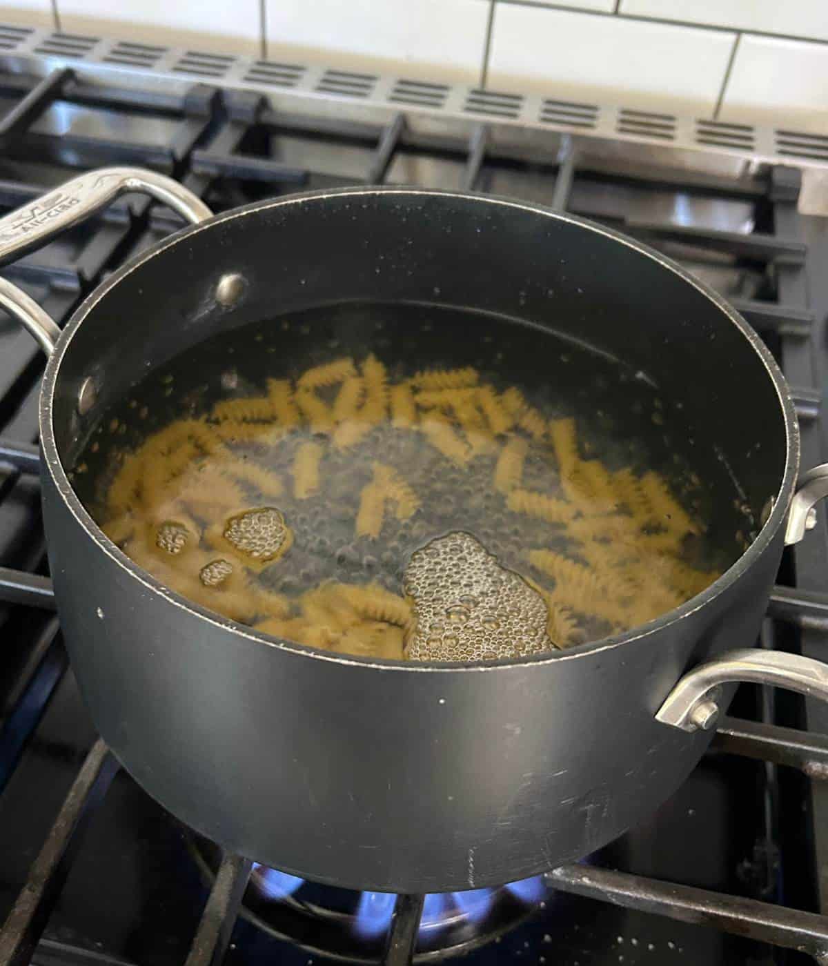 Boiling pasta in pot.