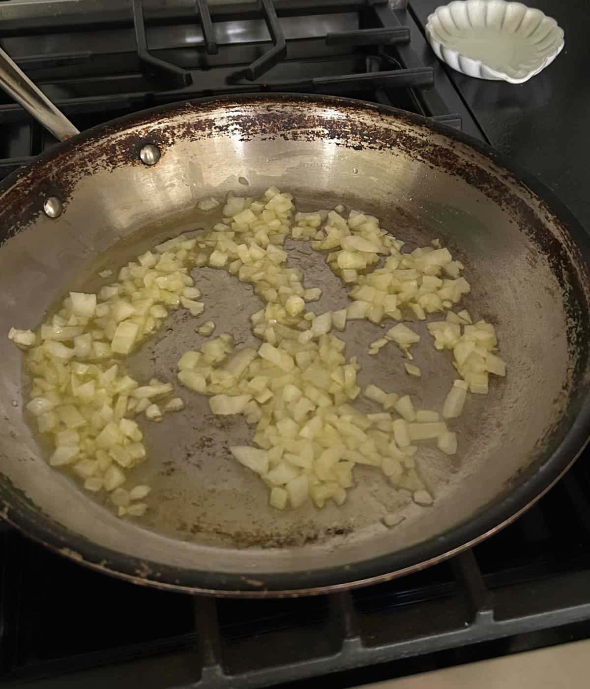 Sautéing onions in pan.