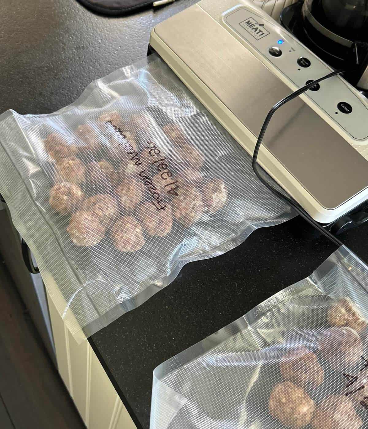 Vacuum sealing frozen meatballs.