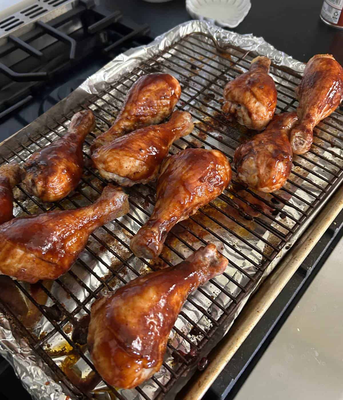 BBQ Sauce over chicken drumsticks.