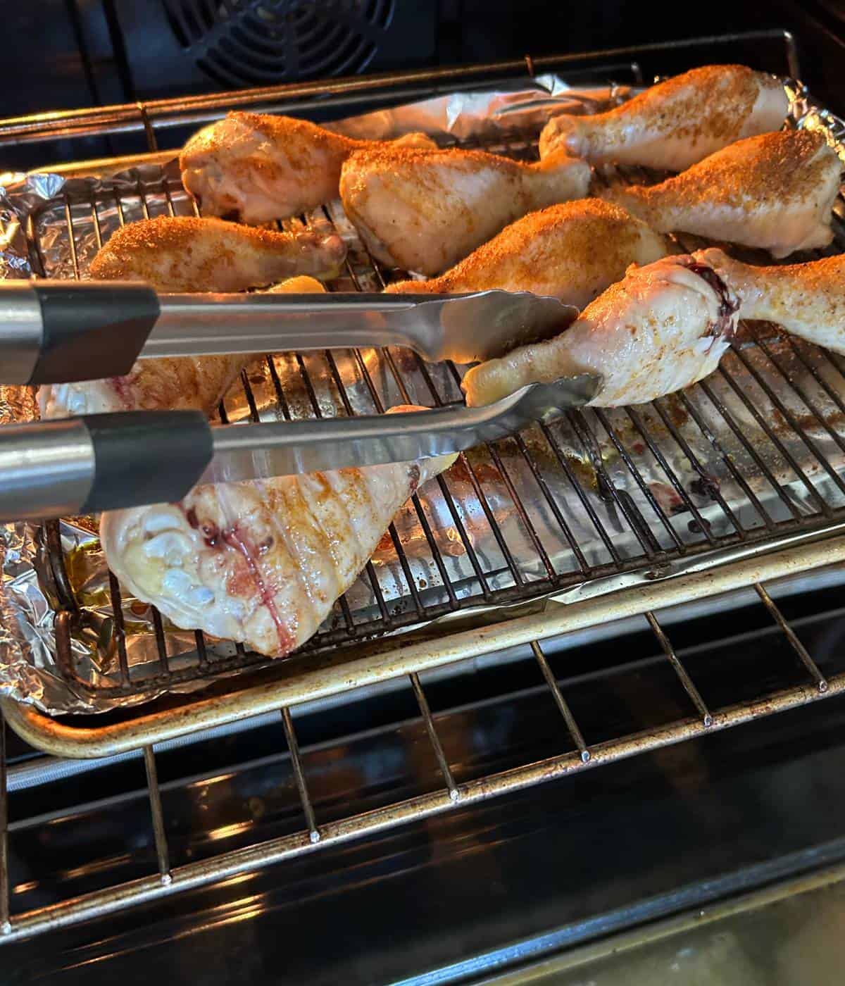 Flipping chicken drumsticks.