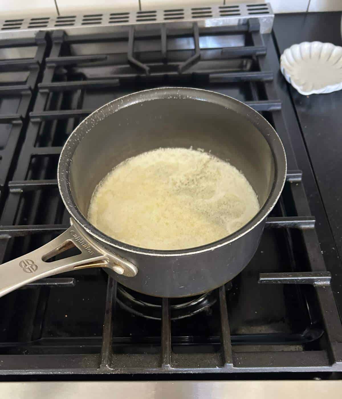 Melted butter in pan.