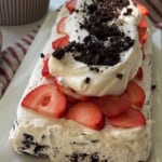 Oreo icebox cake topped with strawberries.