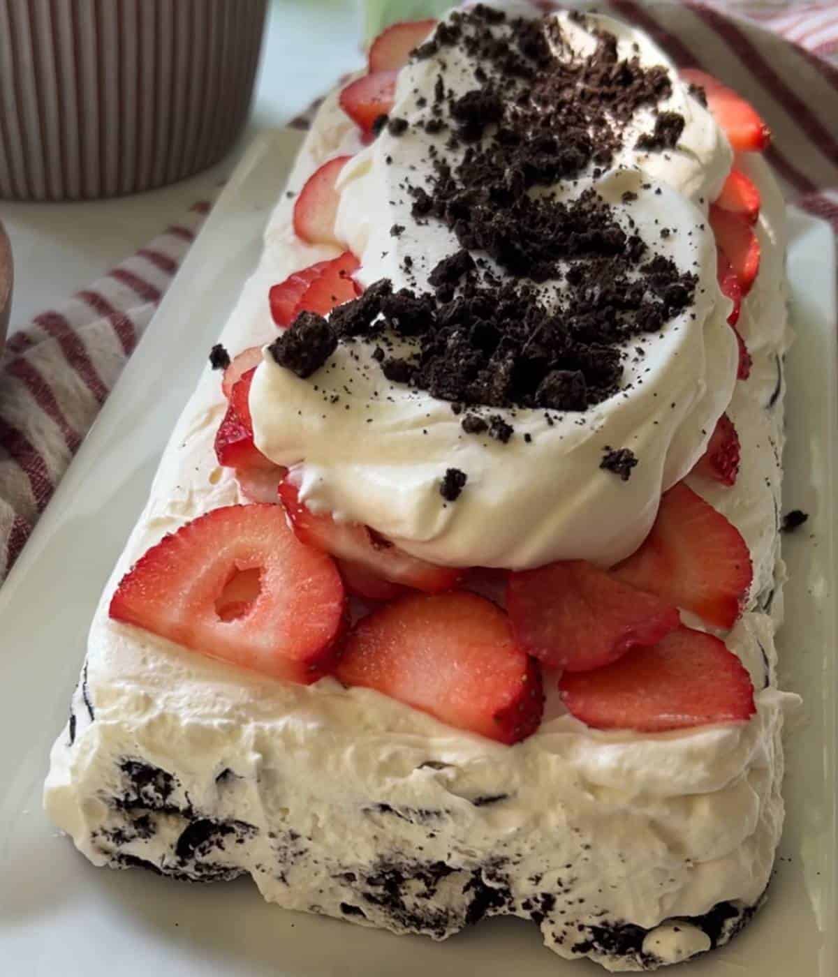 Oreo icebox cake topped with strawberries.