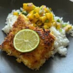Crusted panko cod with rice and Mango Pico De Gallo in bowl.