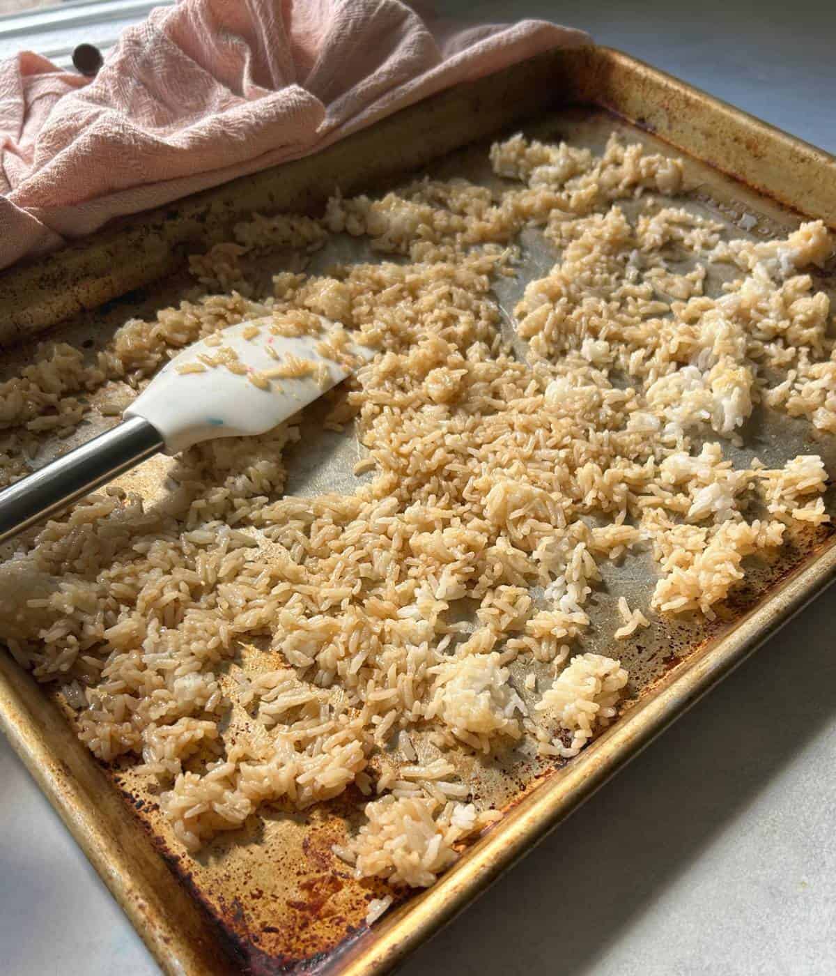 Crispy rice salad spread over cookie sheet.
