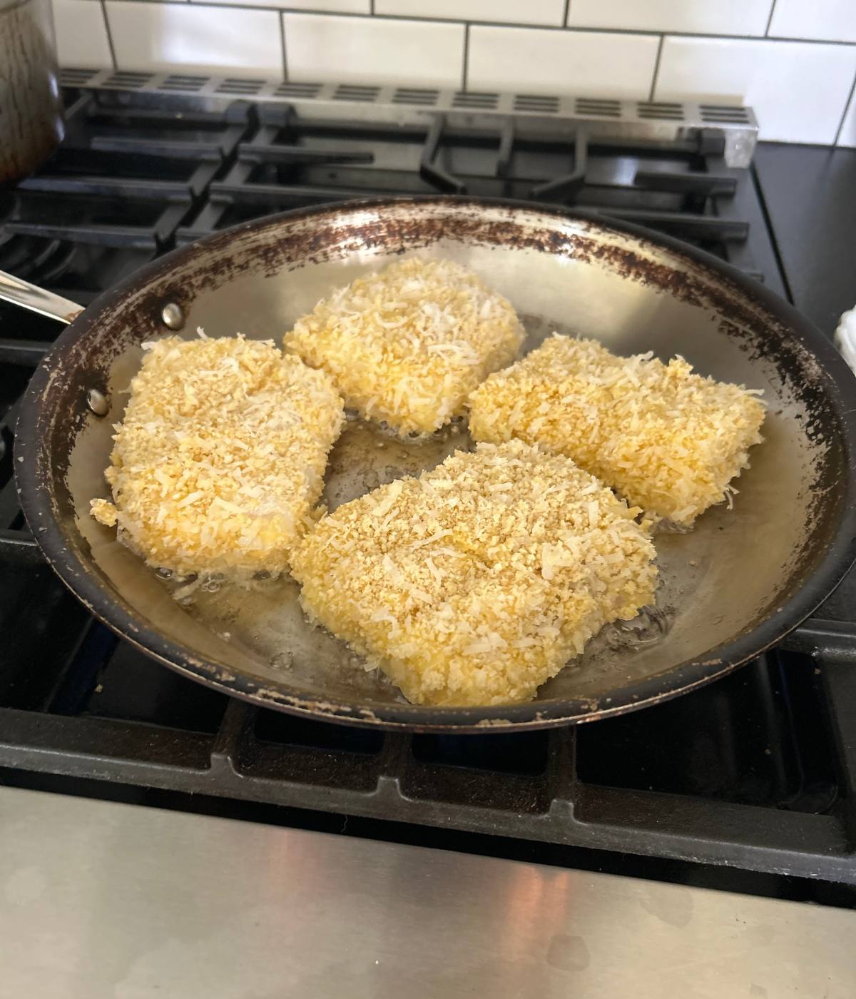 Pan frying fish.
