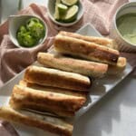 Beef taquitos on plate.